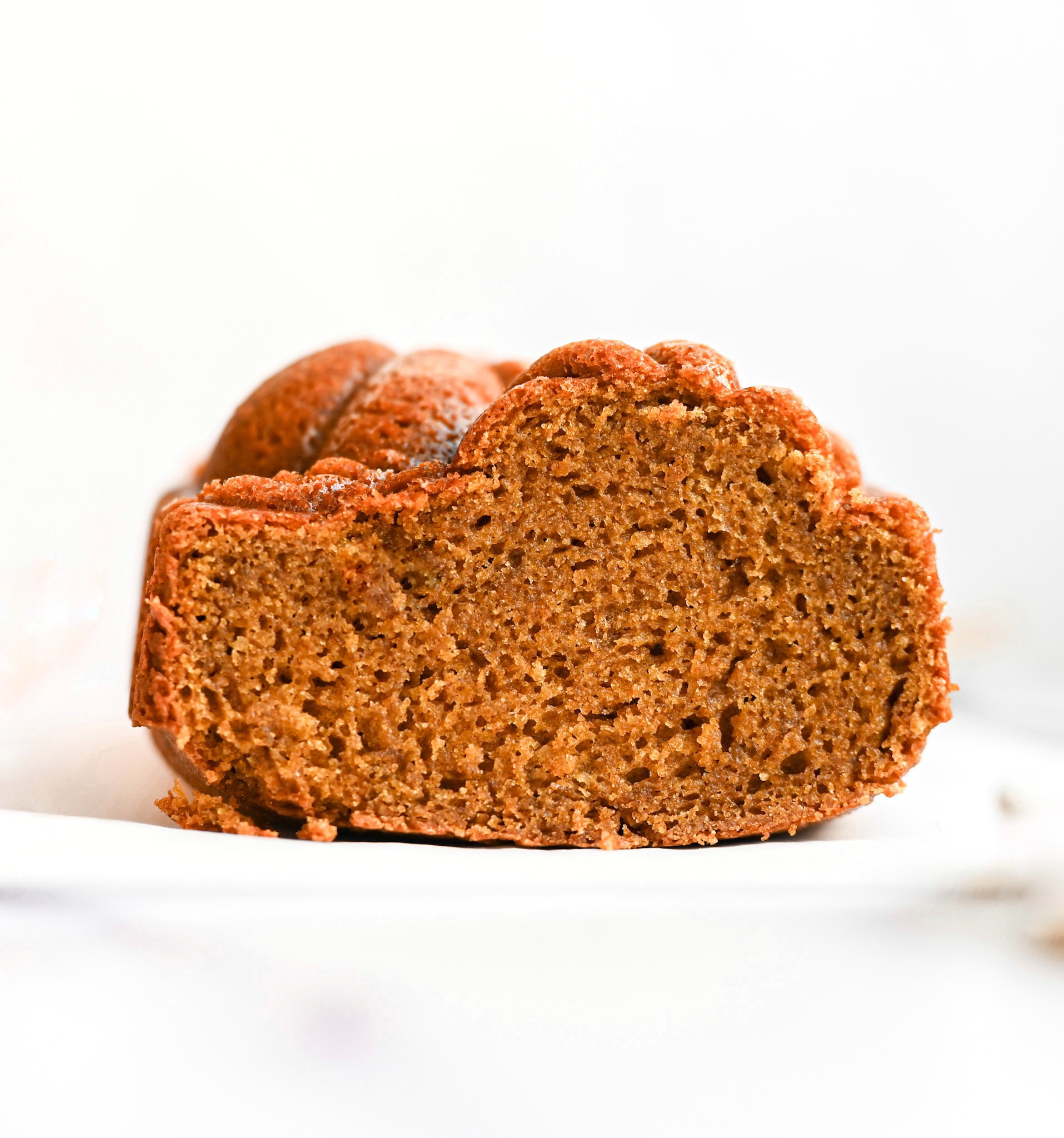 Gluten-Free Pumpkin Bread with a slice cut off the front to see how moist the center is.