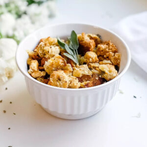 A photo of my gluten-free stuffing, being served in a white bowl.