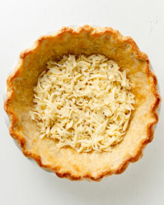 Cheese added to the bottom of pie crust.