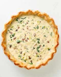 Gluten Free Bacon Spinach and Leek Quiche filling prior to baking.