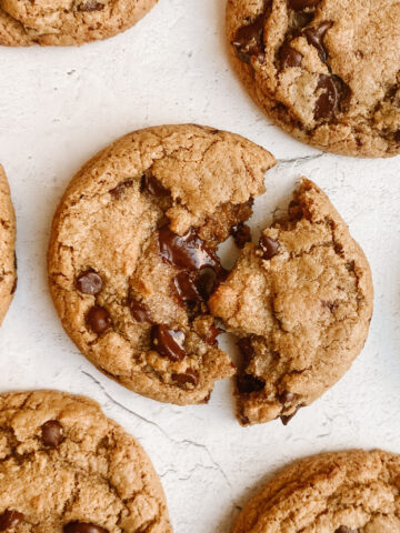 gooey brown butter chocolate chip cookie splitting apart and showing melted chocolate