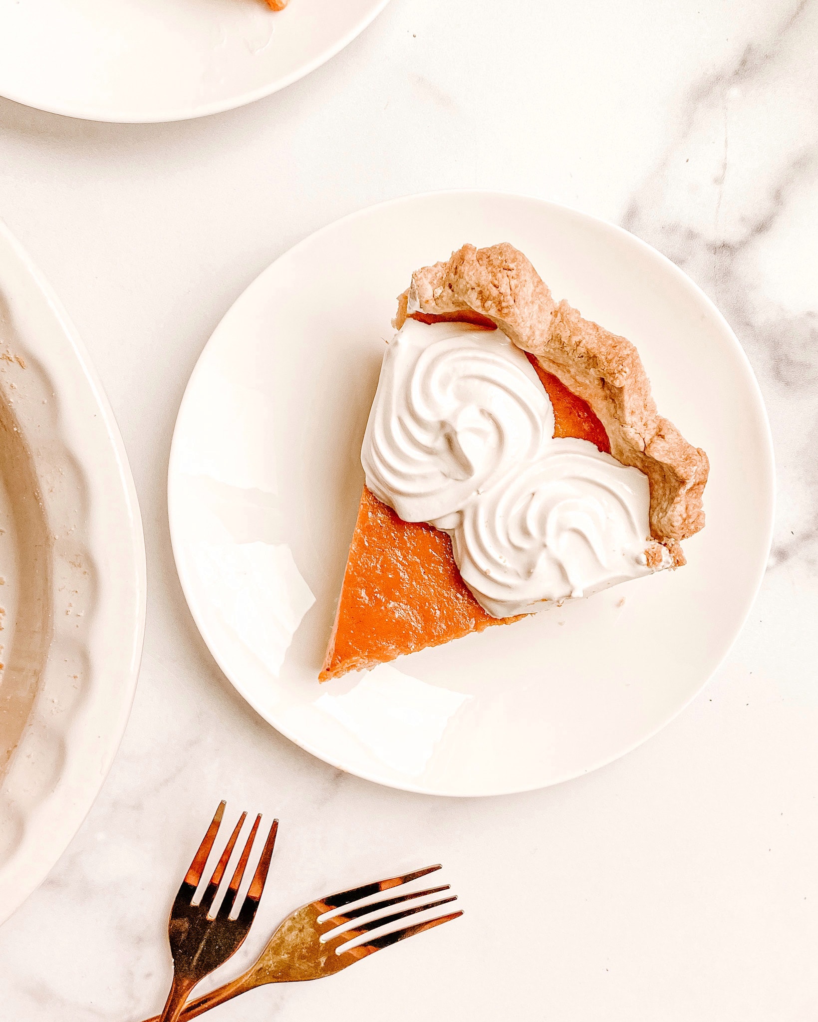 gluten-free pumpkin pie slice on a white plate