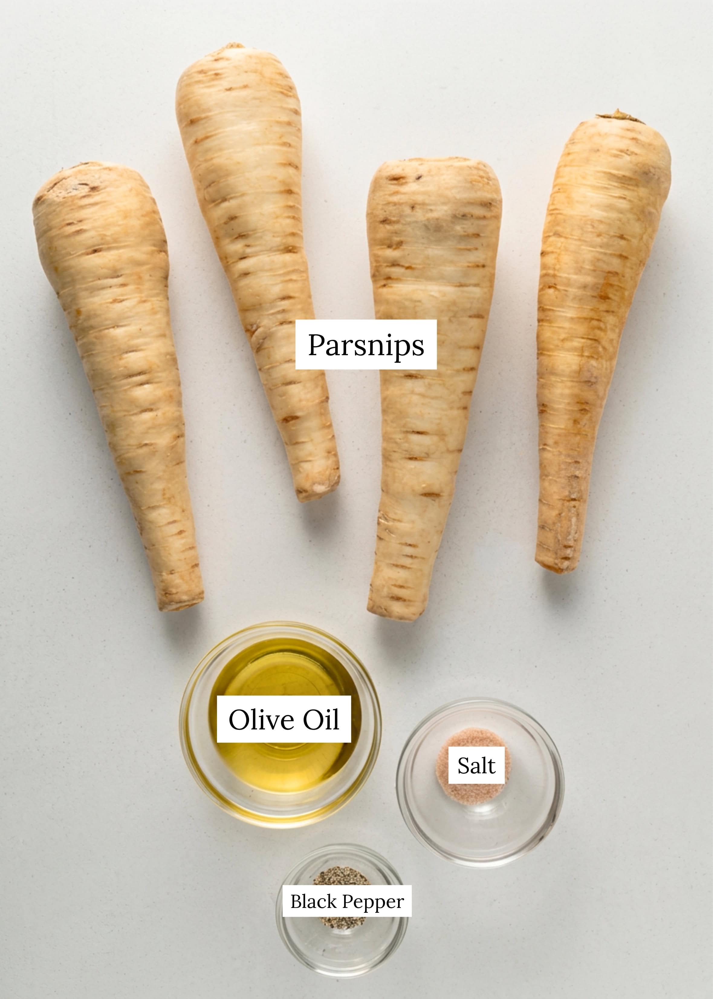 Ingredients for roasted parsnips. Parsnips, olive oil, salt, and black pepper.