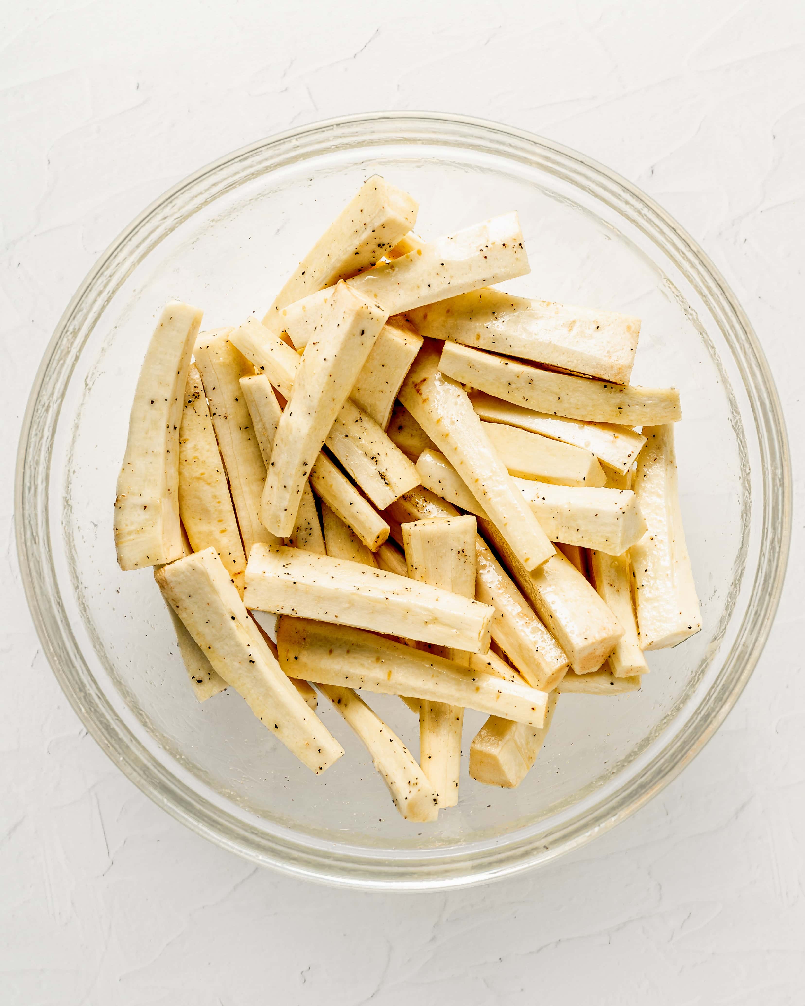 Coat the parsnips in olive oil, salt, and black pepper.