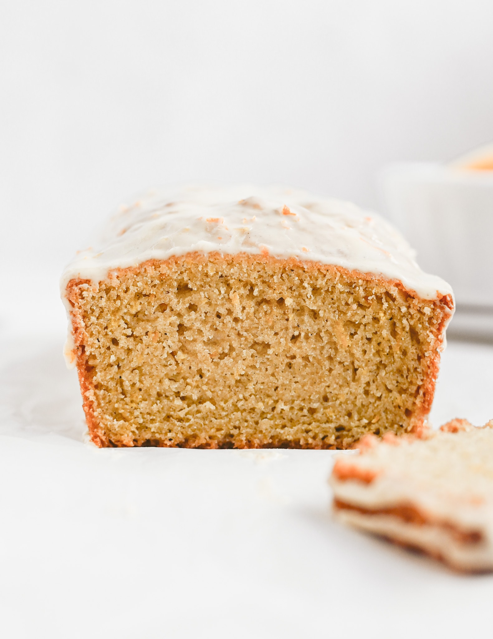 gluten free orange cardamom bread with a sliced removed reveal a soft moist interior