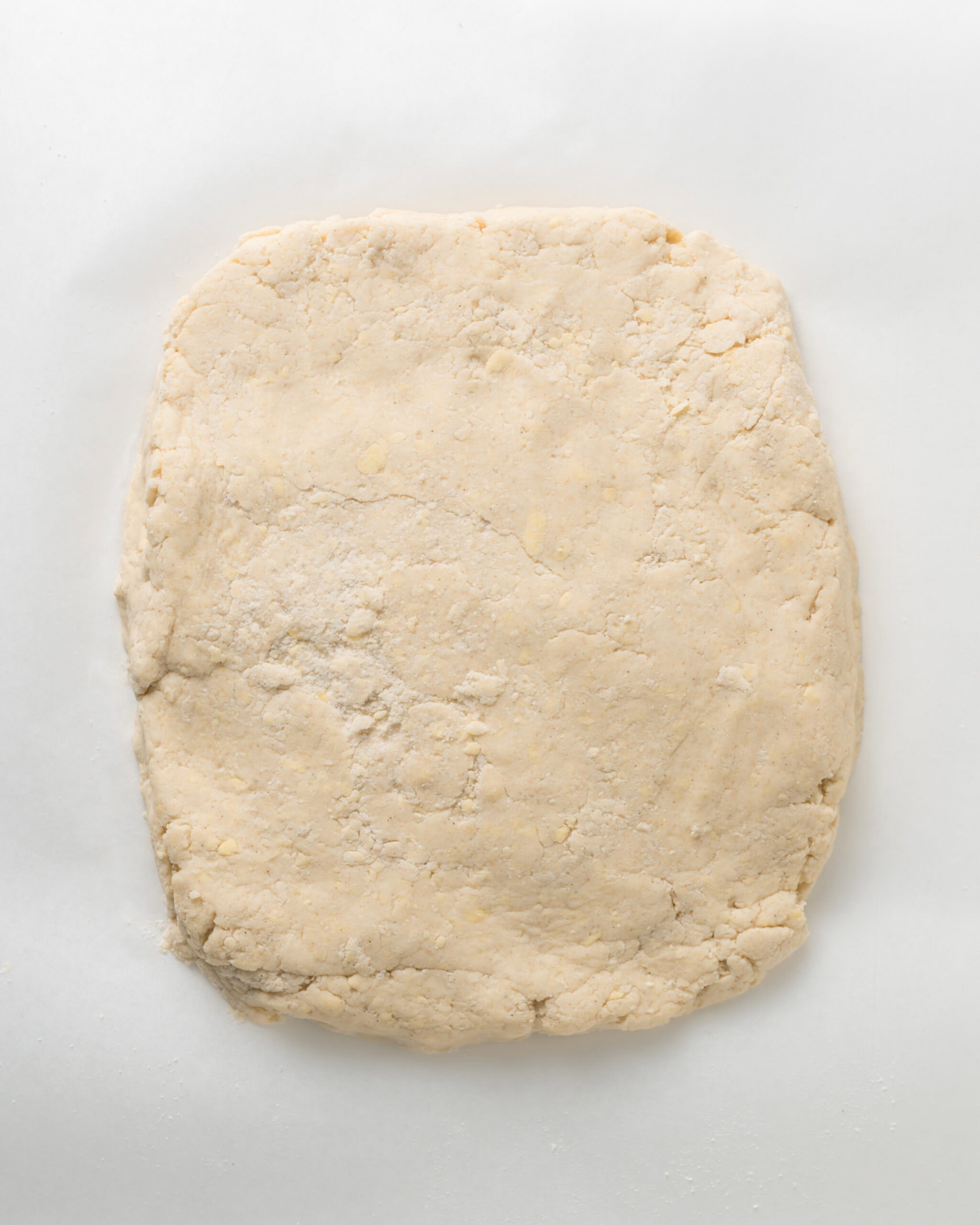 Flatten the biscuit dough into a rectangle.