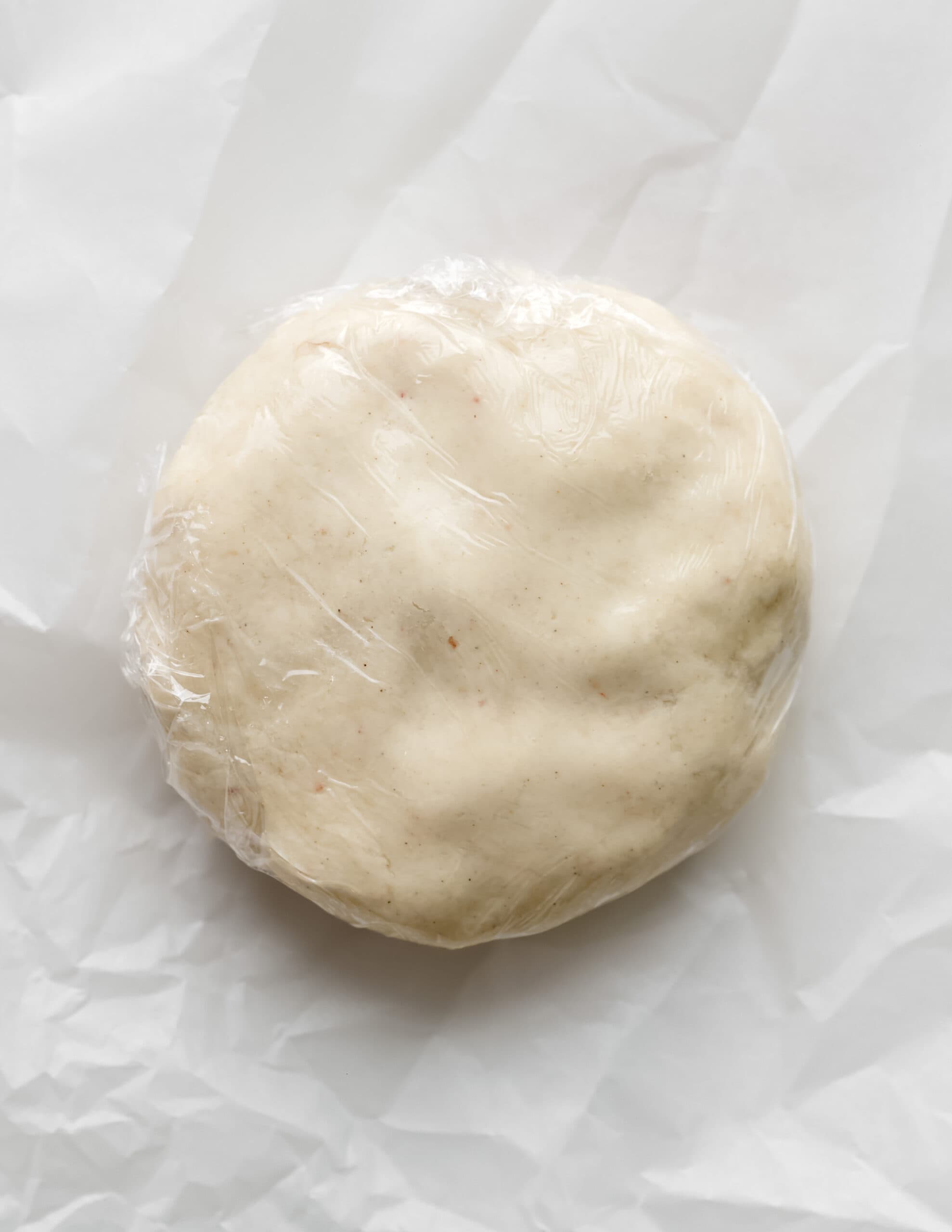 A flat disc if wrapped dough.