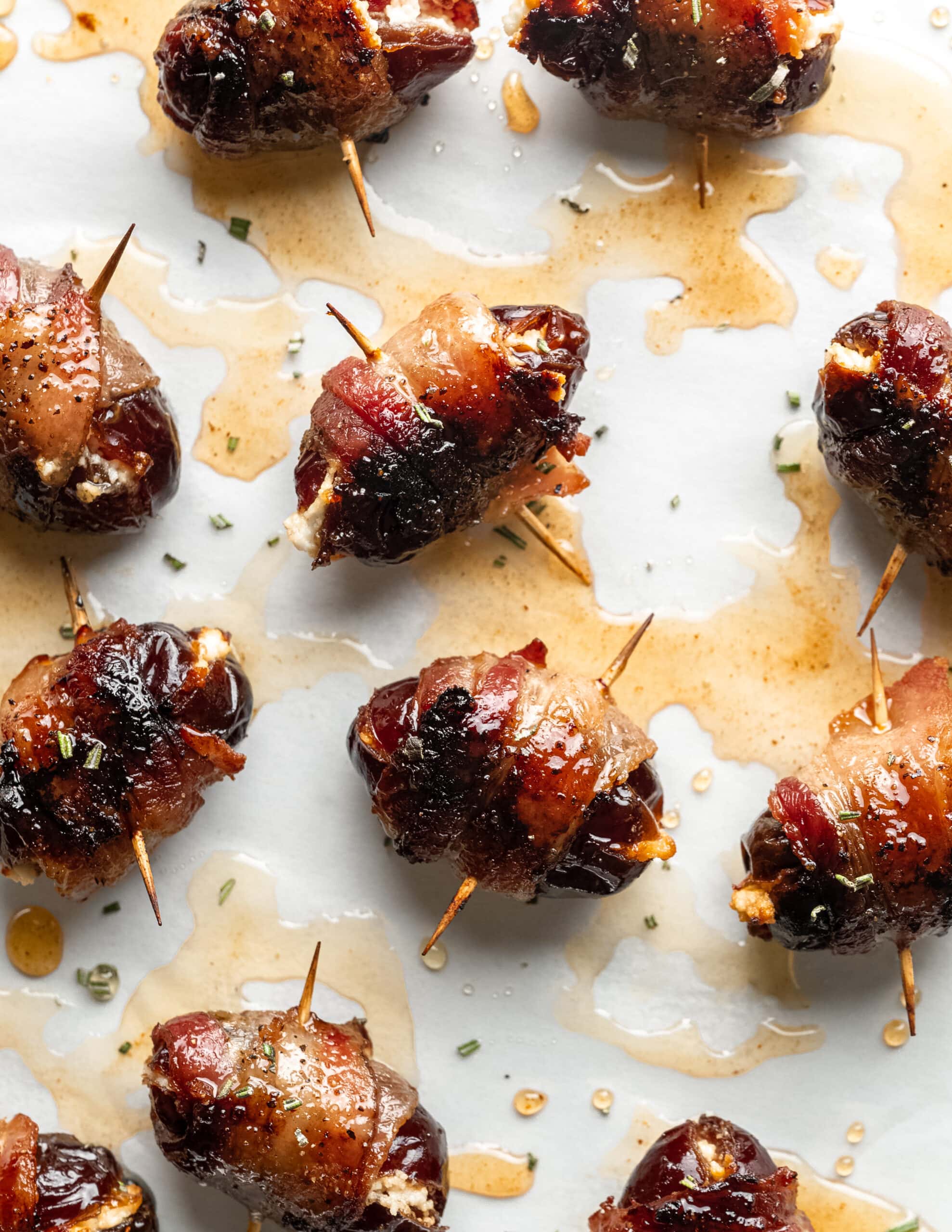 Bacon wrapped dates stuffed with goat cheese, drizzle with honey and sprinkled with finely minced rosemary.
