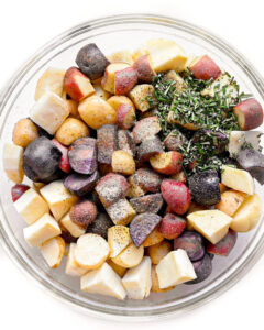 Rainbow potatoes diced and placed in a large bowl.