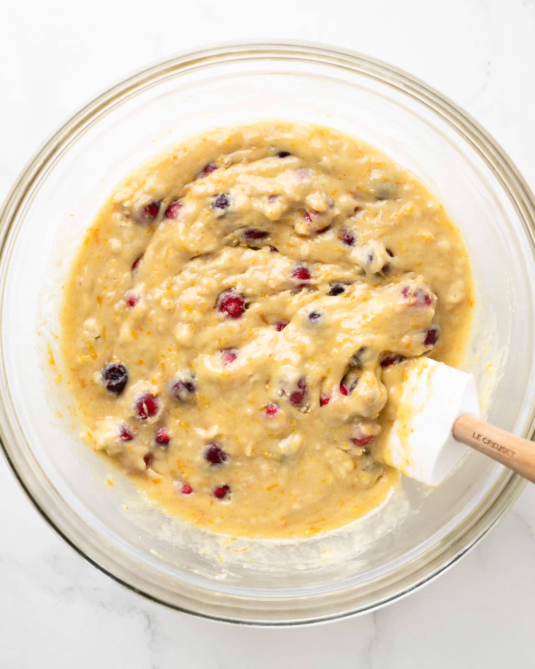 Added cranberries to muffin batter.