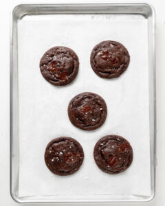 Double chocolate cookies and a baking tray.