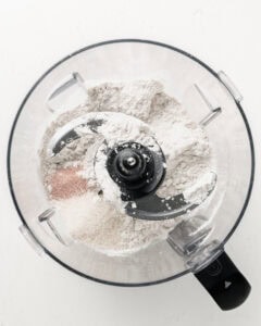 Mixing the dry ingredients in a food processor for pir crust.