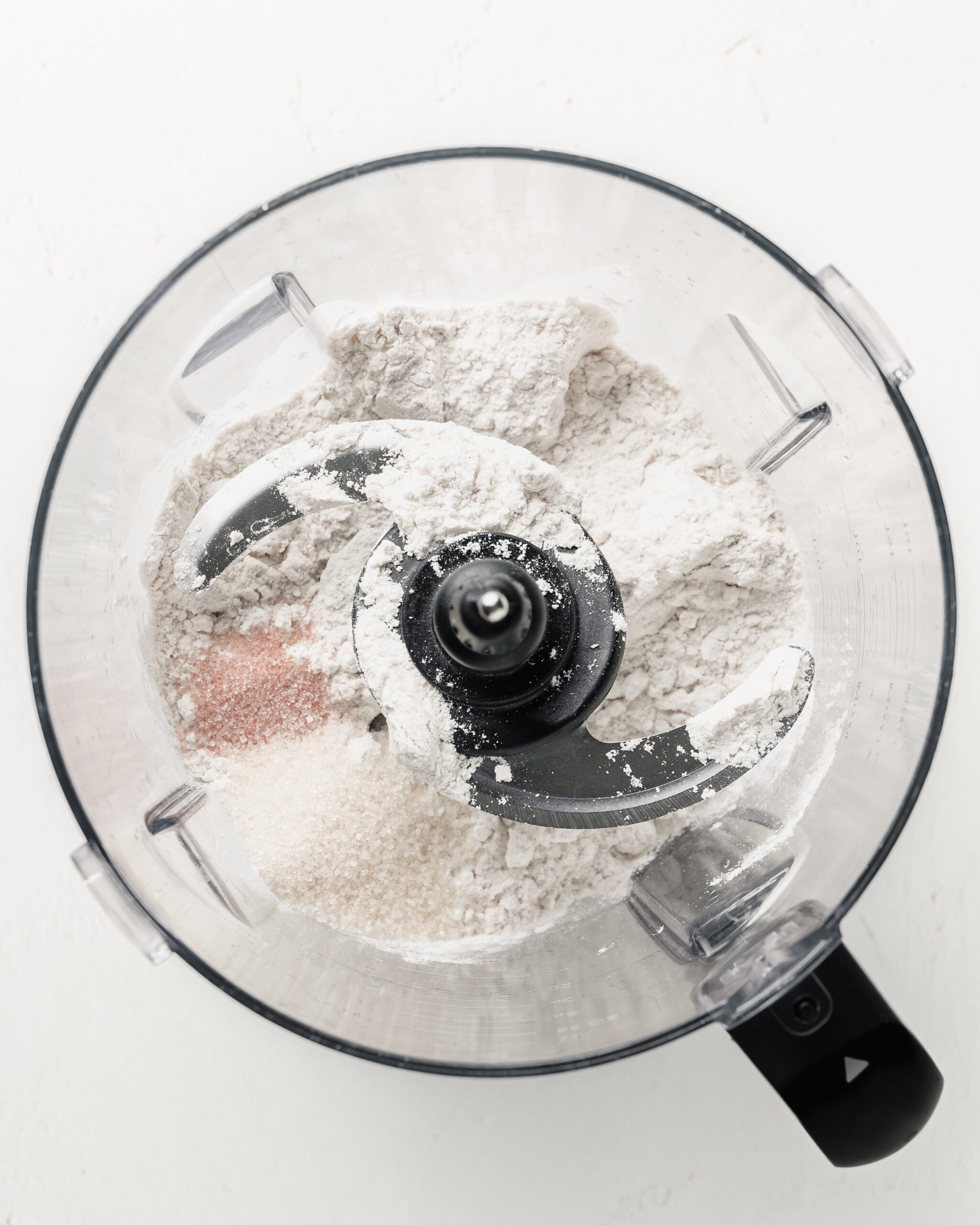 Mixing the dry ingredients in a food processor for pir crust.