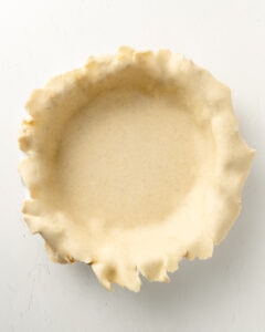 Transfer the pie crust to a pie dish.