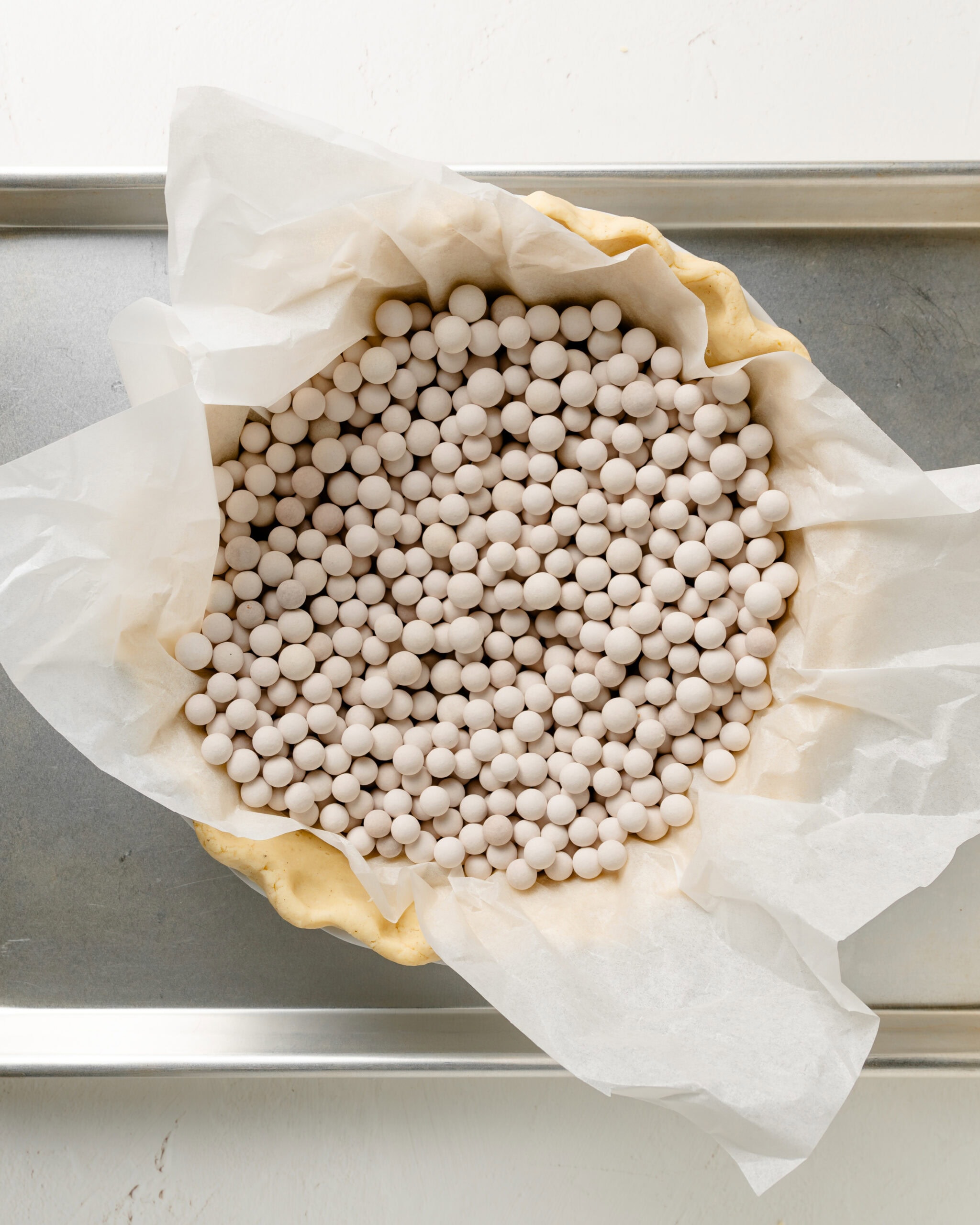 Blind baking pie crust with pie weights.