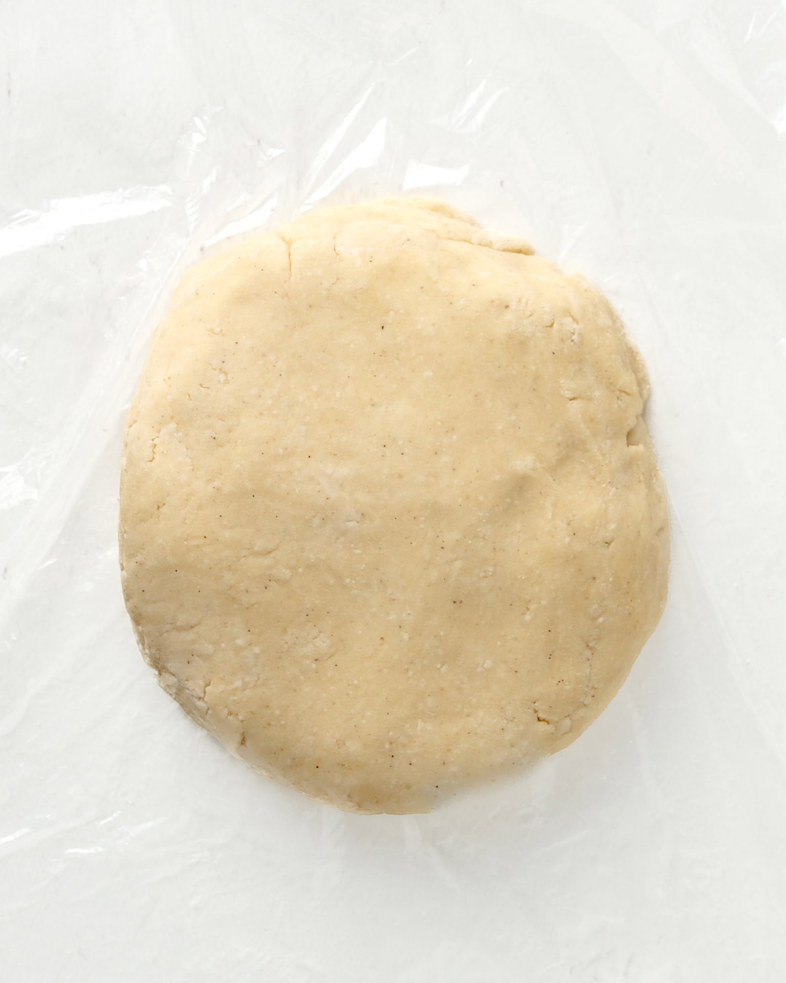 shaping the pie dough into a 1 inch disk.