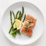garlic herb salmon with garlic capers and a side of roasted asparagus.