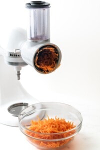Shredding carrots for carrot cake.