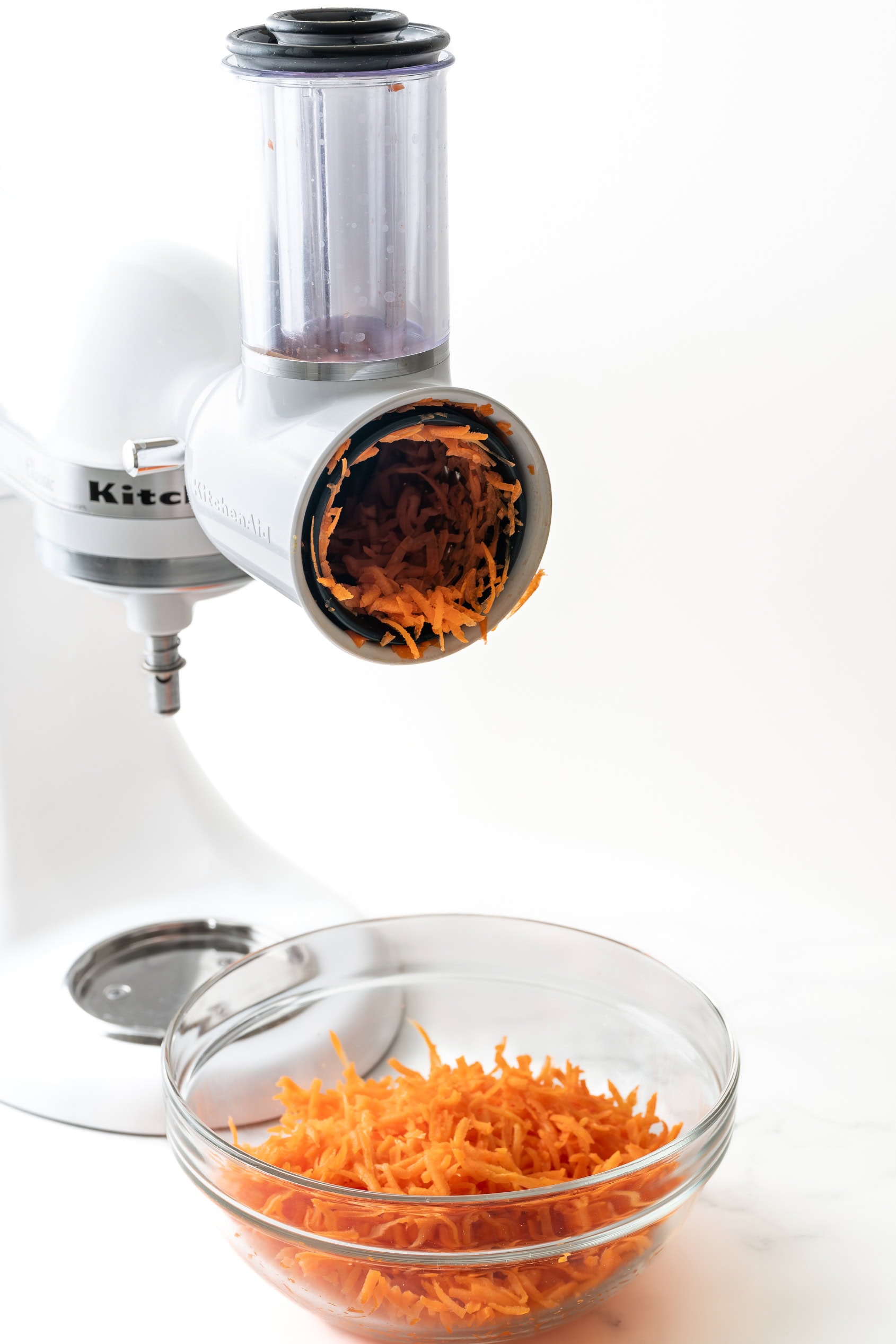 Shredding carrots for carrot cake.