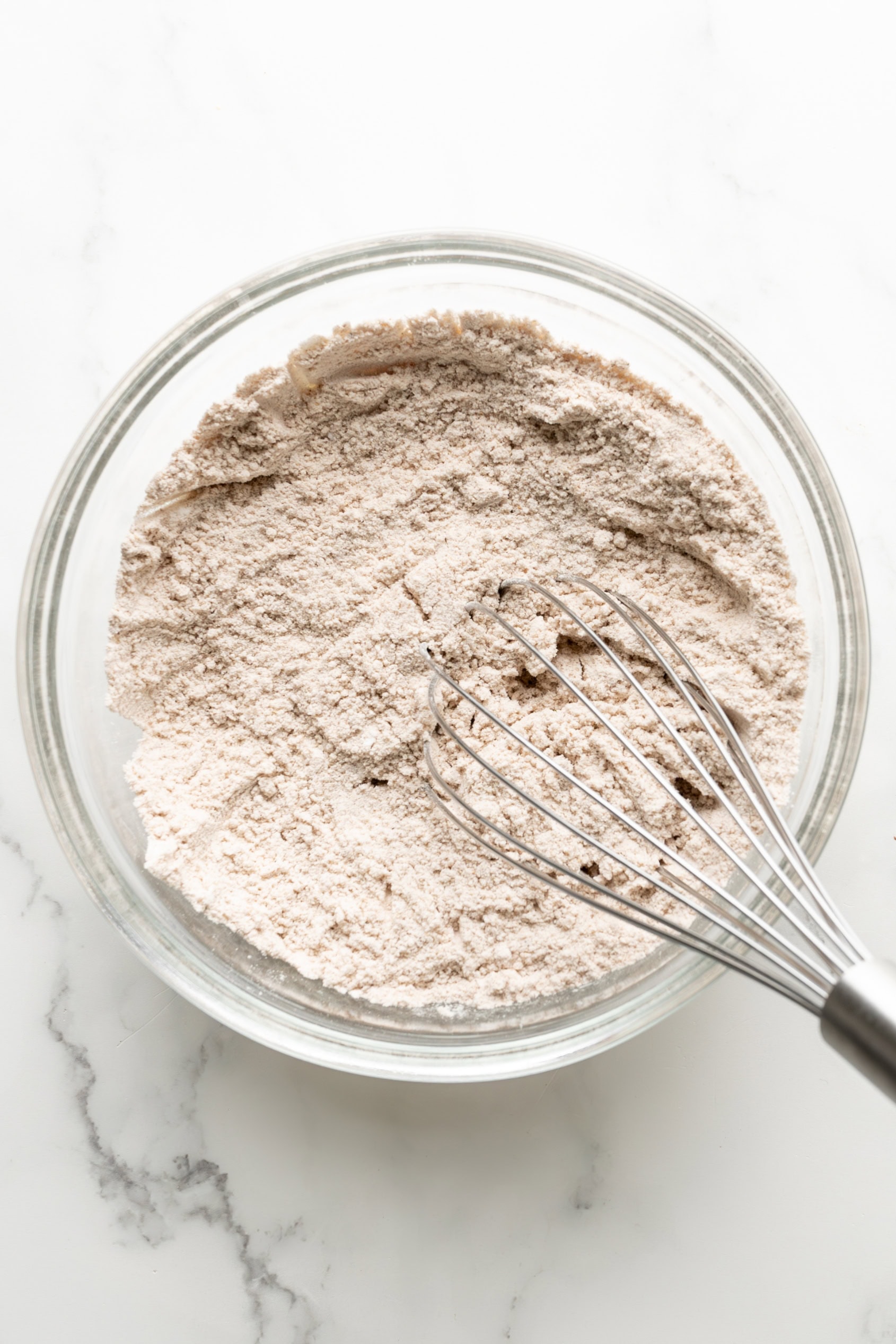 Mix dry ingredients for carrot cake cupcakes.