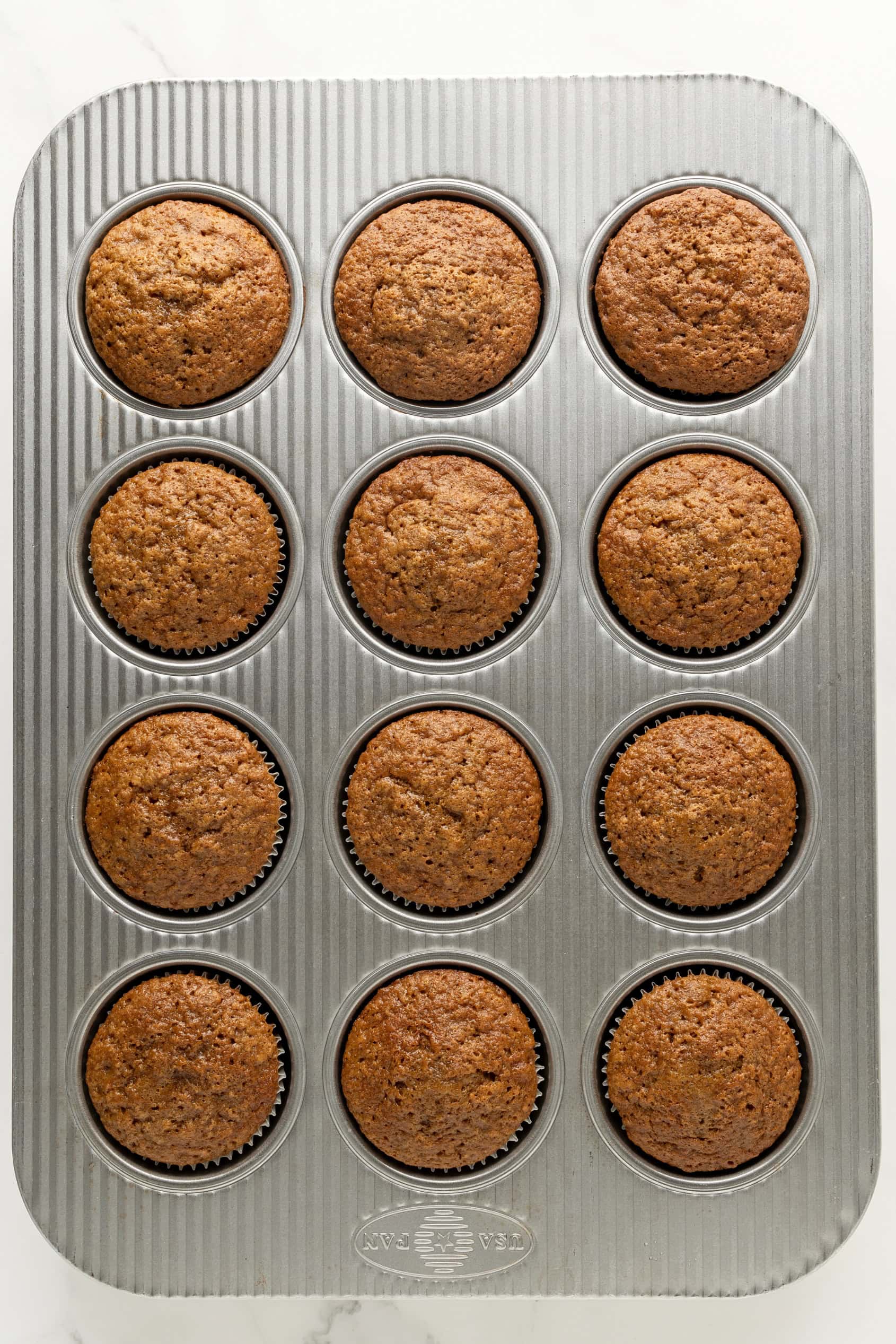Baked carrot cake cupcakes.