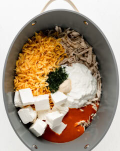 Add everything to slow cooker for buffalo chicken dip.