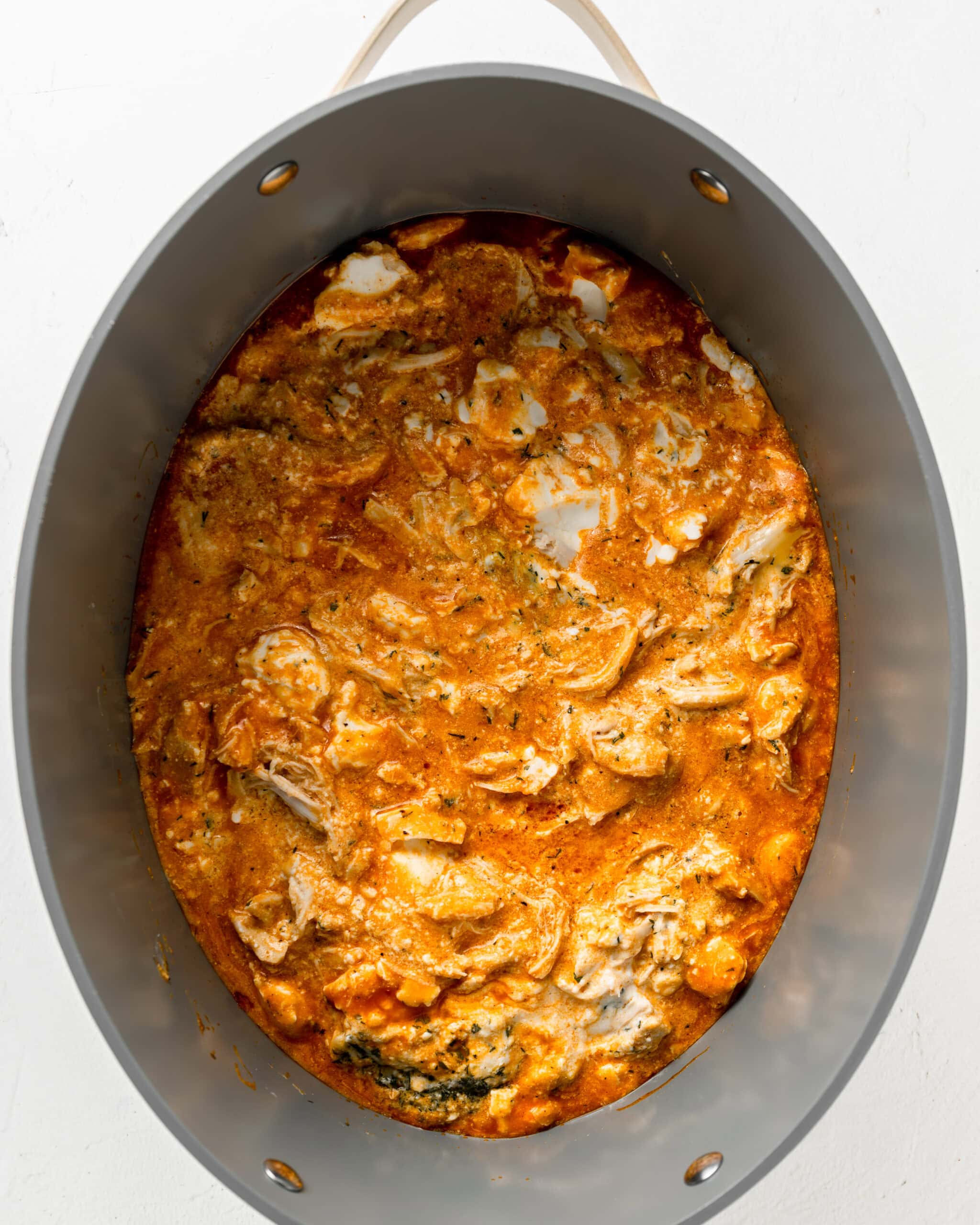 Buffalo chicken dip in crockpot.