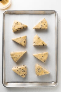Brush chocolate chip scones with egg wash.