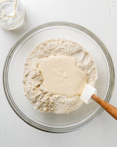 Adding dry and wet ingredients together for chocolate chip scones