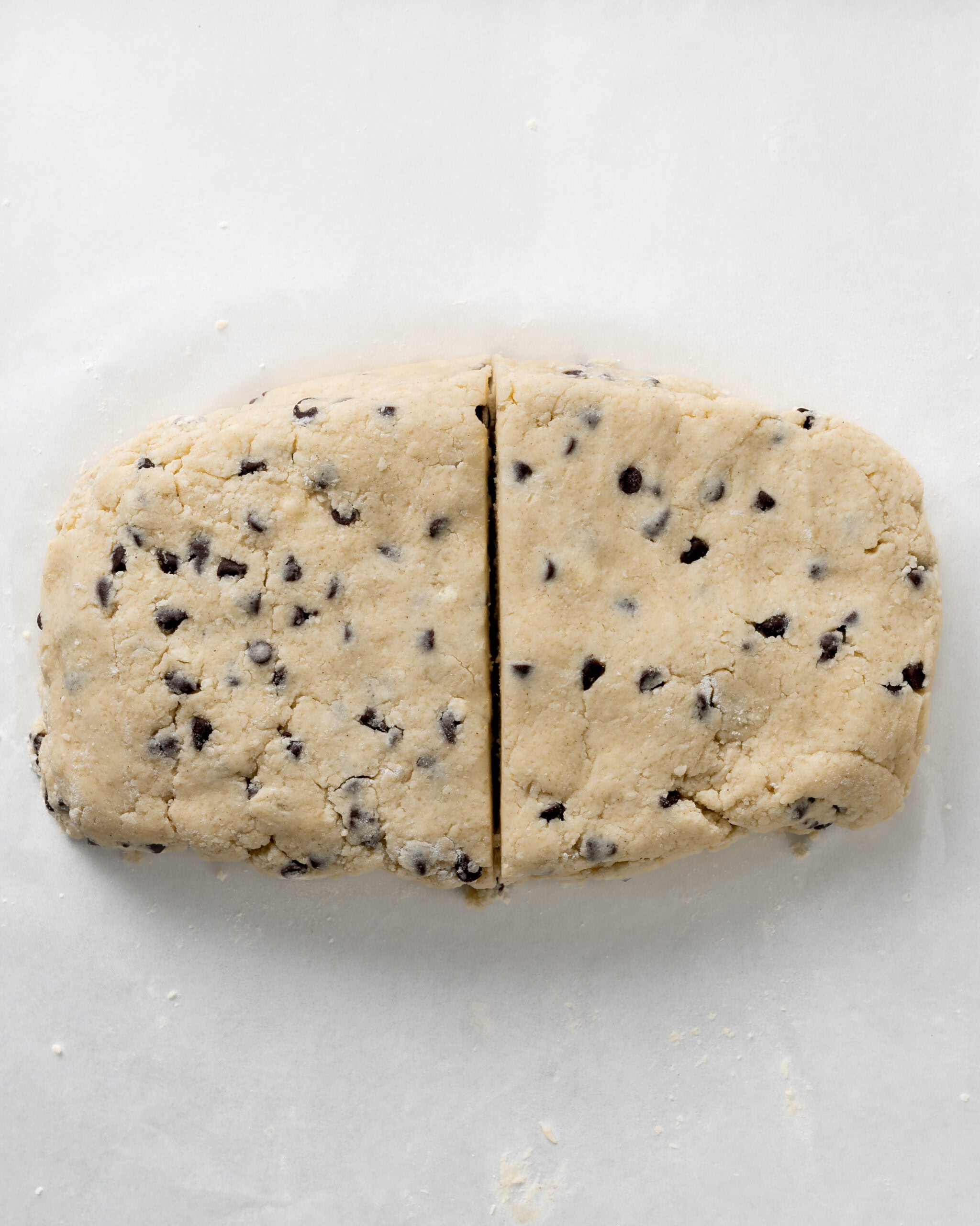 Chocolate Chip Scone Dough Cut In Half.