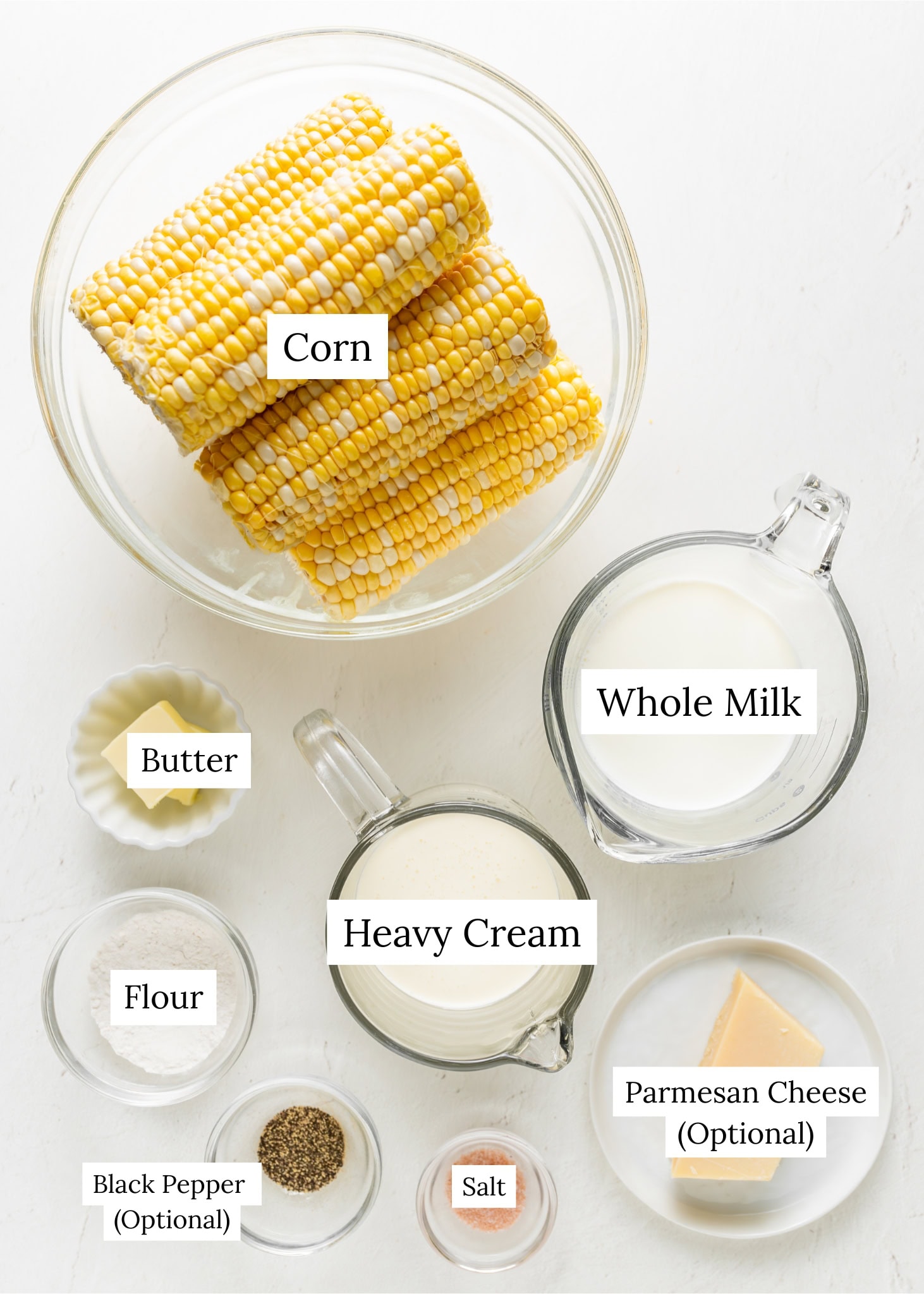 Creamed corn ingredients. Fresh corn with milk, heavy cream, butter, and seasoning.