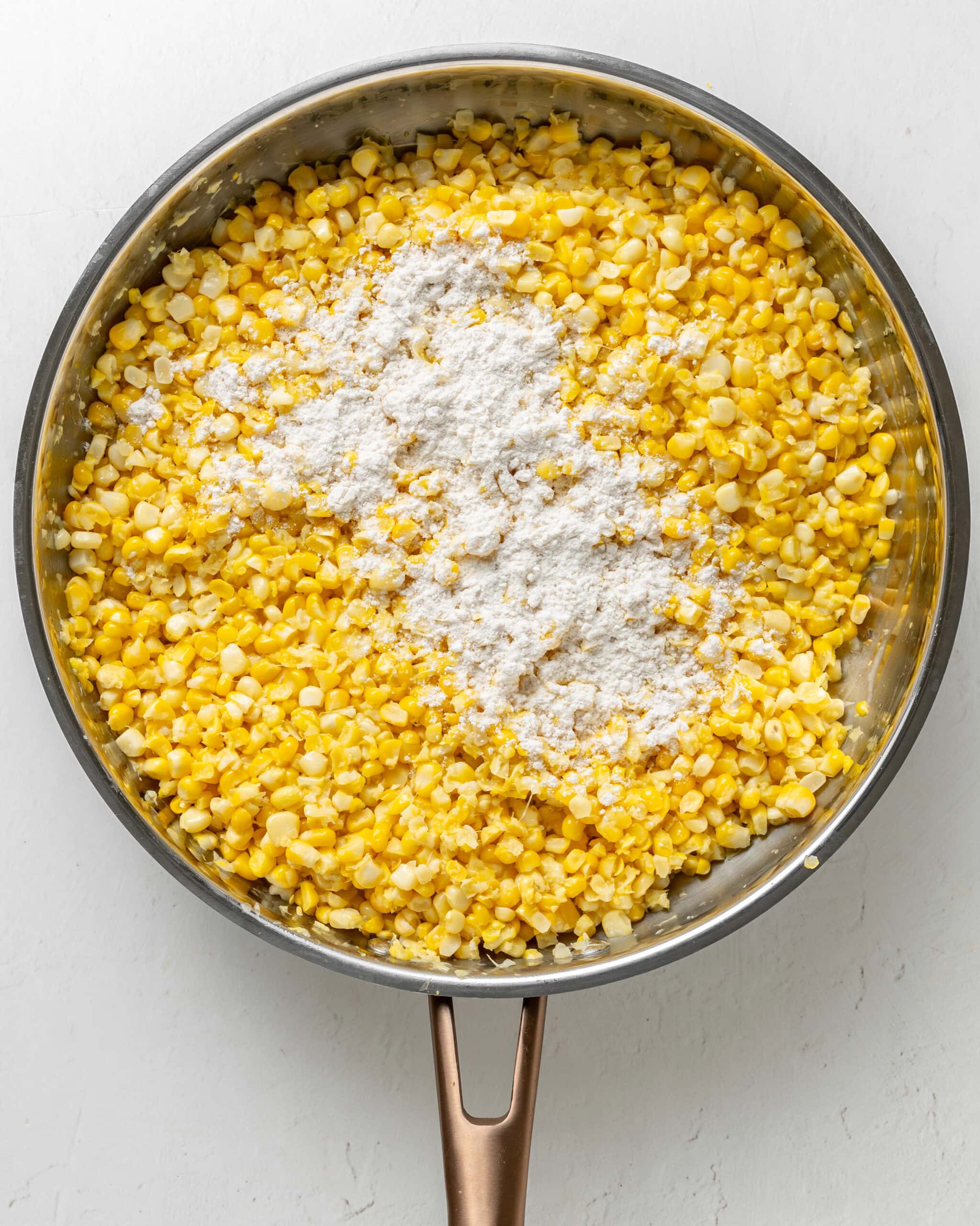 Creamed corn with flour with a skillet.