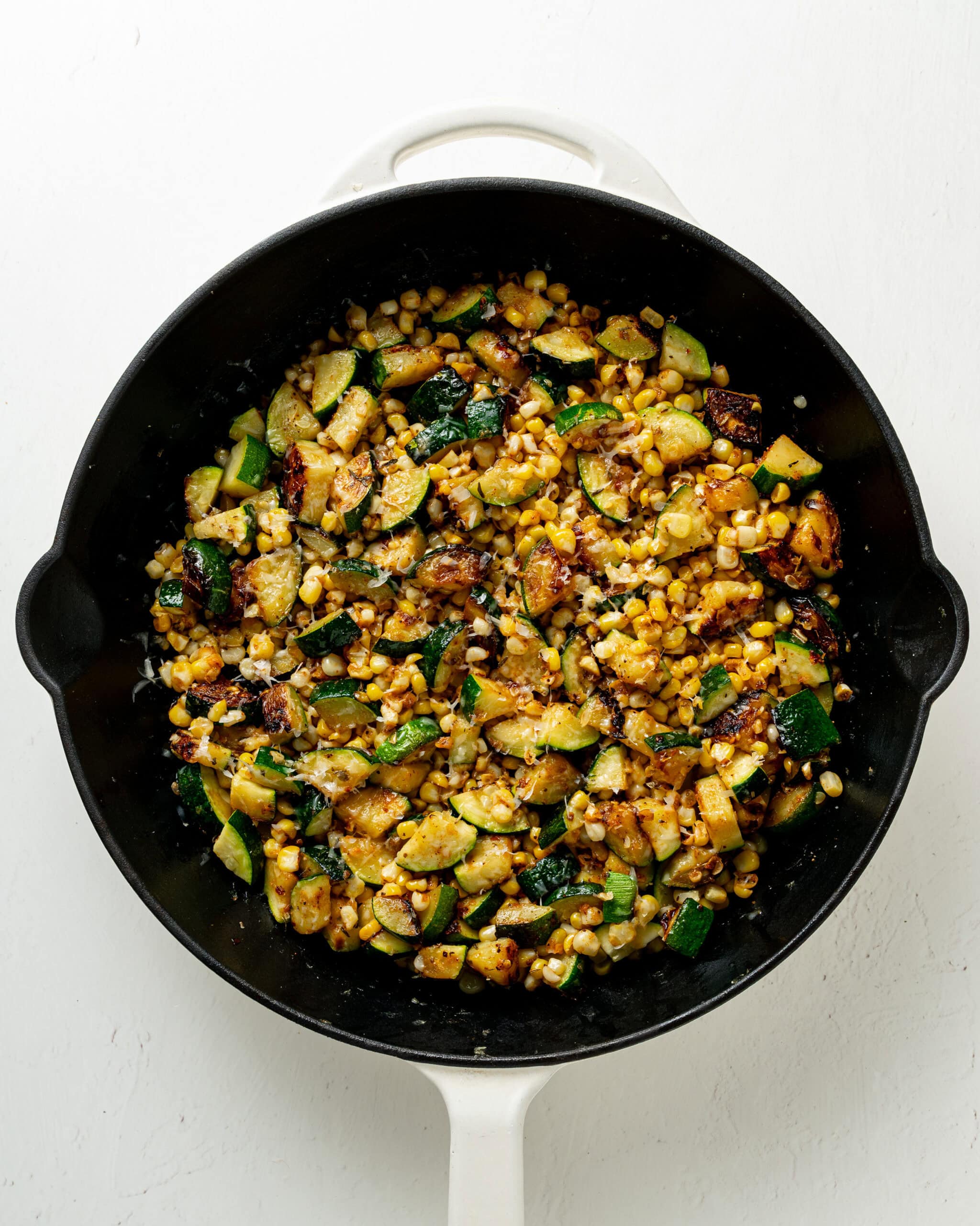 zucchini and corn sauteed with spices and cheese.