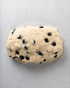 Blueberry scone dough folded into a rectangle.