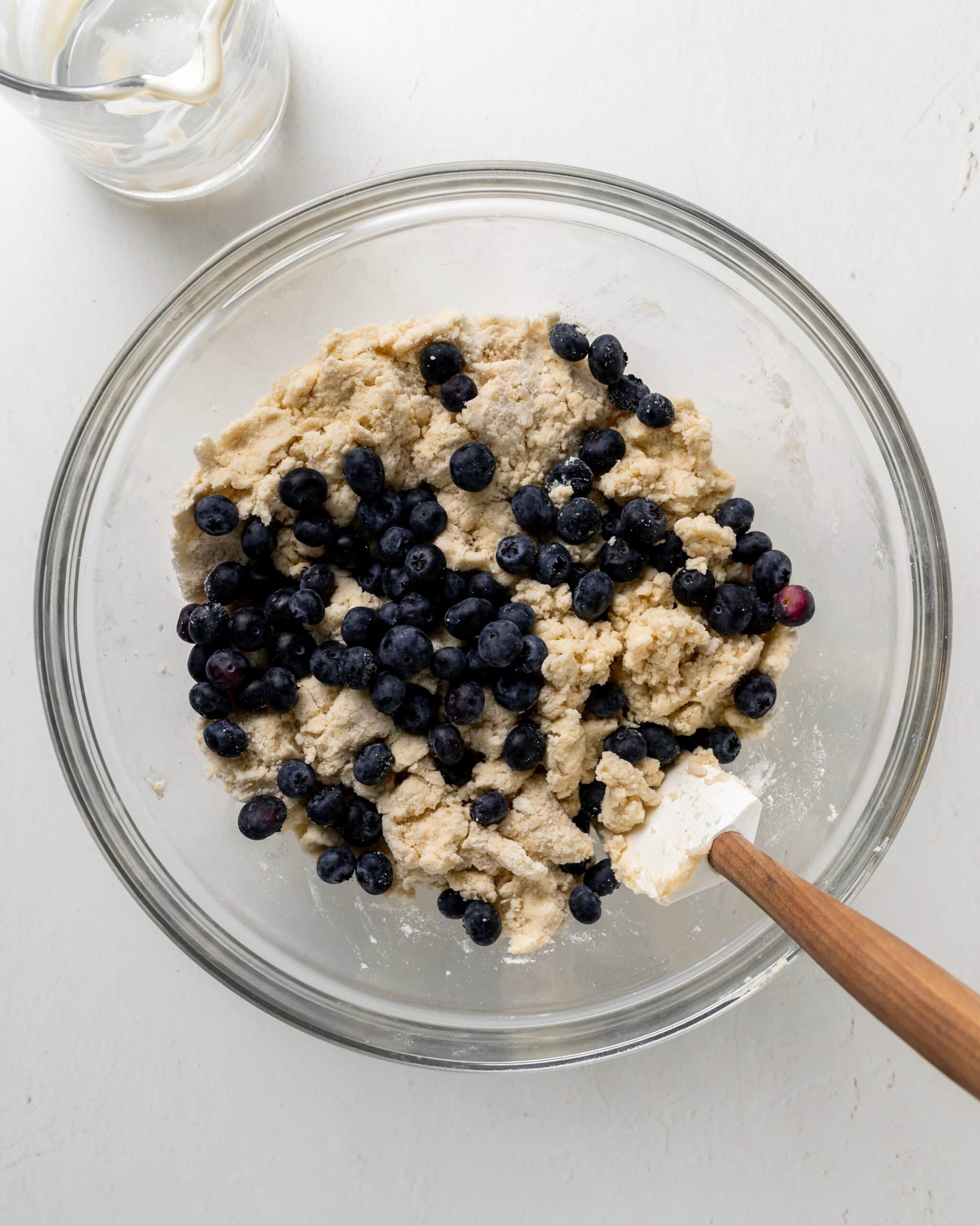 Blueberries being folded into the scone dough.
