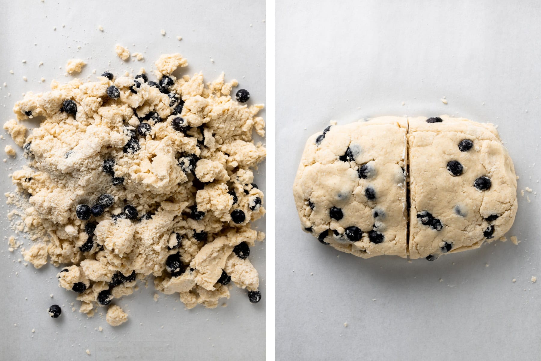 Scone dough being rolled out and fold into a rectangle, then cut in half with blueberries exposed.