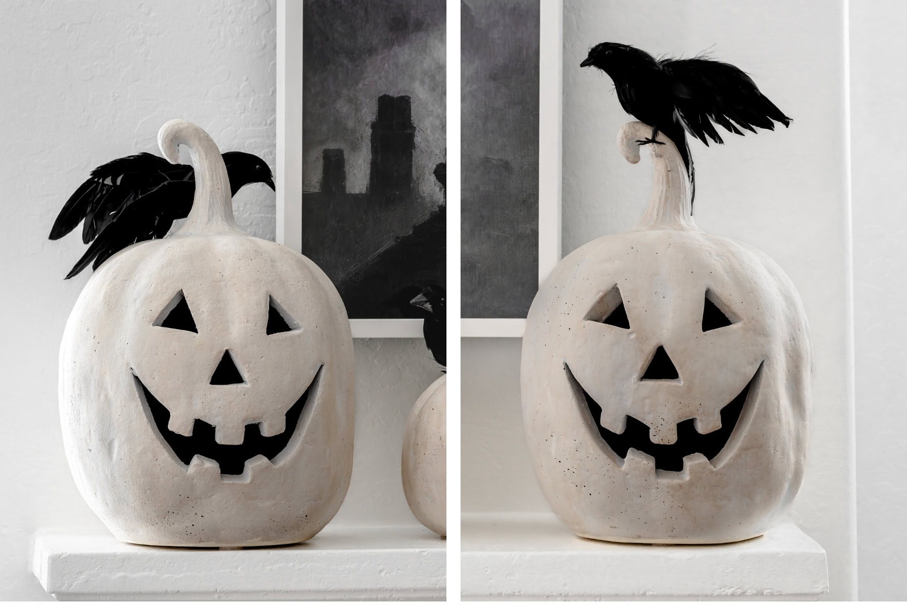 Close up of white terracotta pumpkins with black crows.
