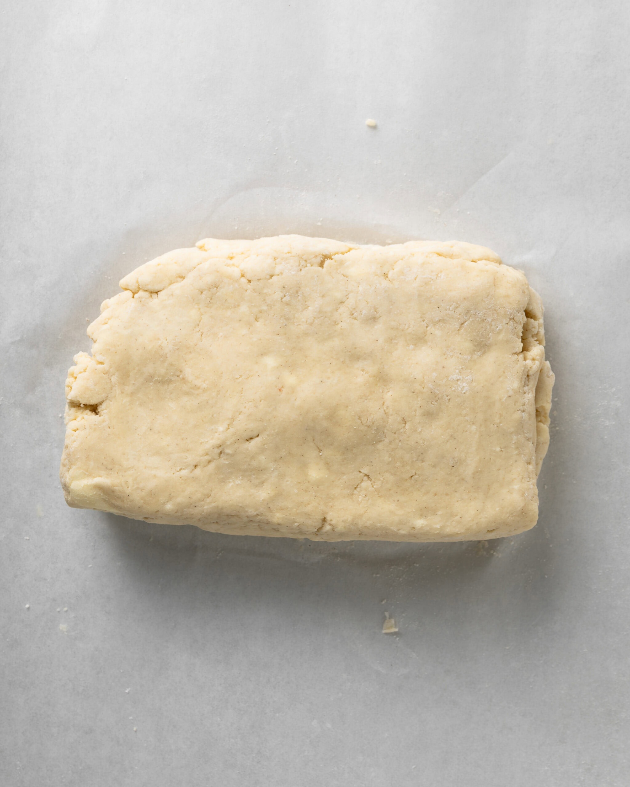 Cut, stack, and flatten the scone dough.