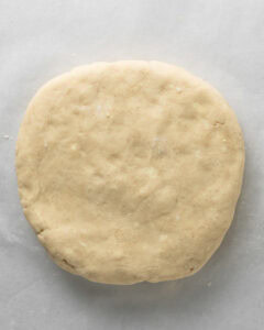 Round disk of plain scone dough.