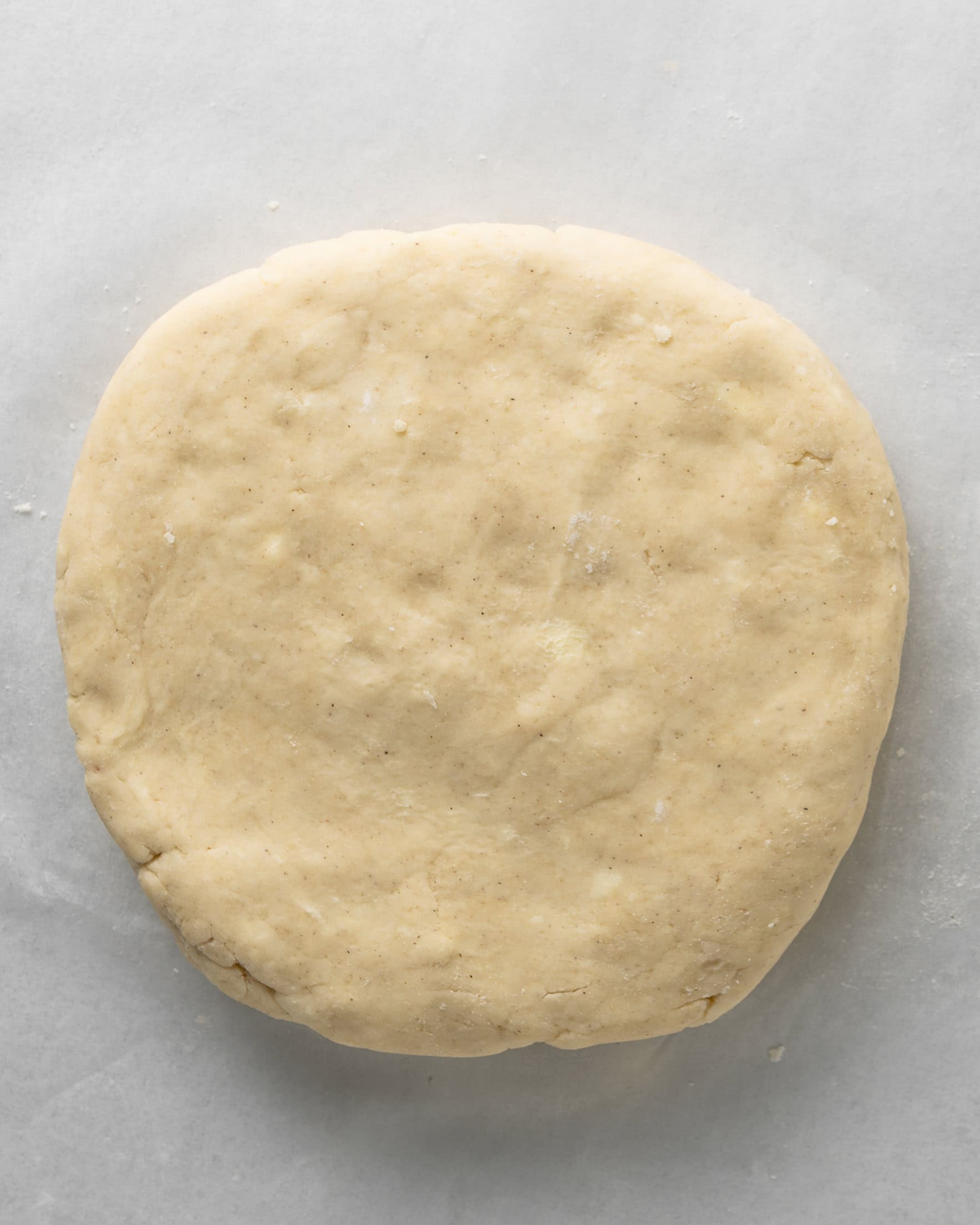 Round disk of plain scone dough.