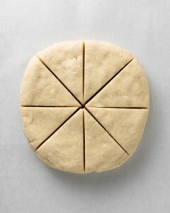 Cut the plain scone dough into triangles.