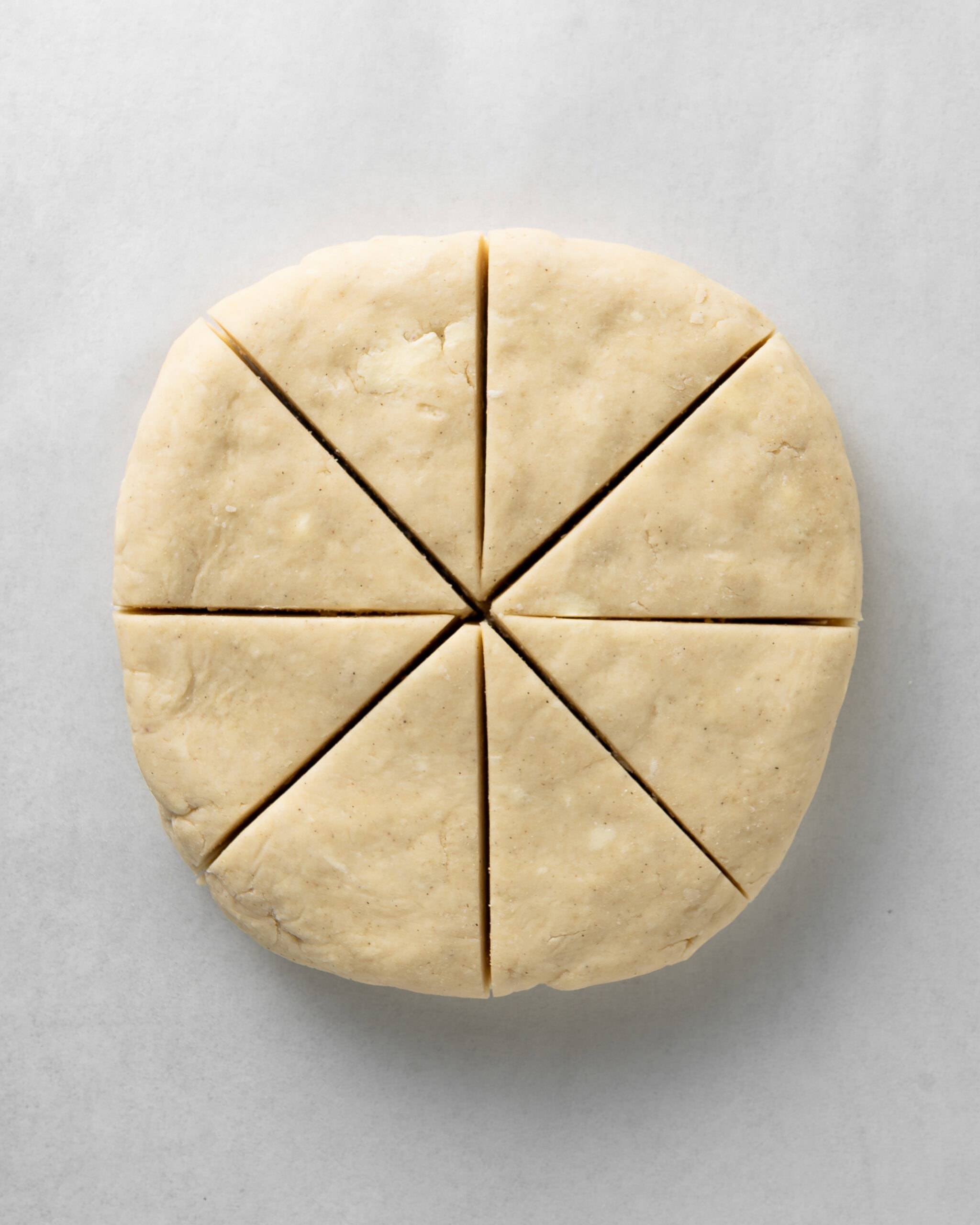 Cut the plain scone dough into triangles.