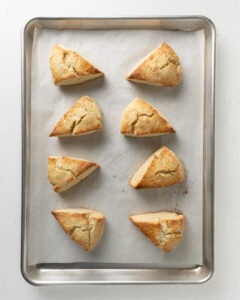 Baked gluten free scone on a large baking sheet.