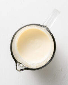 Sour cream, heavy cream, and egg whisked together for plain scones.