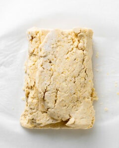 Laminating the cornmeal biscuit dough.