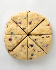 Cranberry Orange Scones cut into 8 triangle wedges.