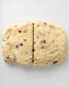 Cut the cranberry orange scone in half.