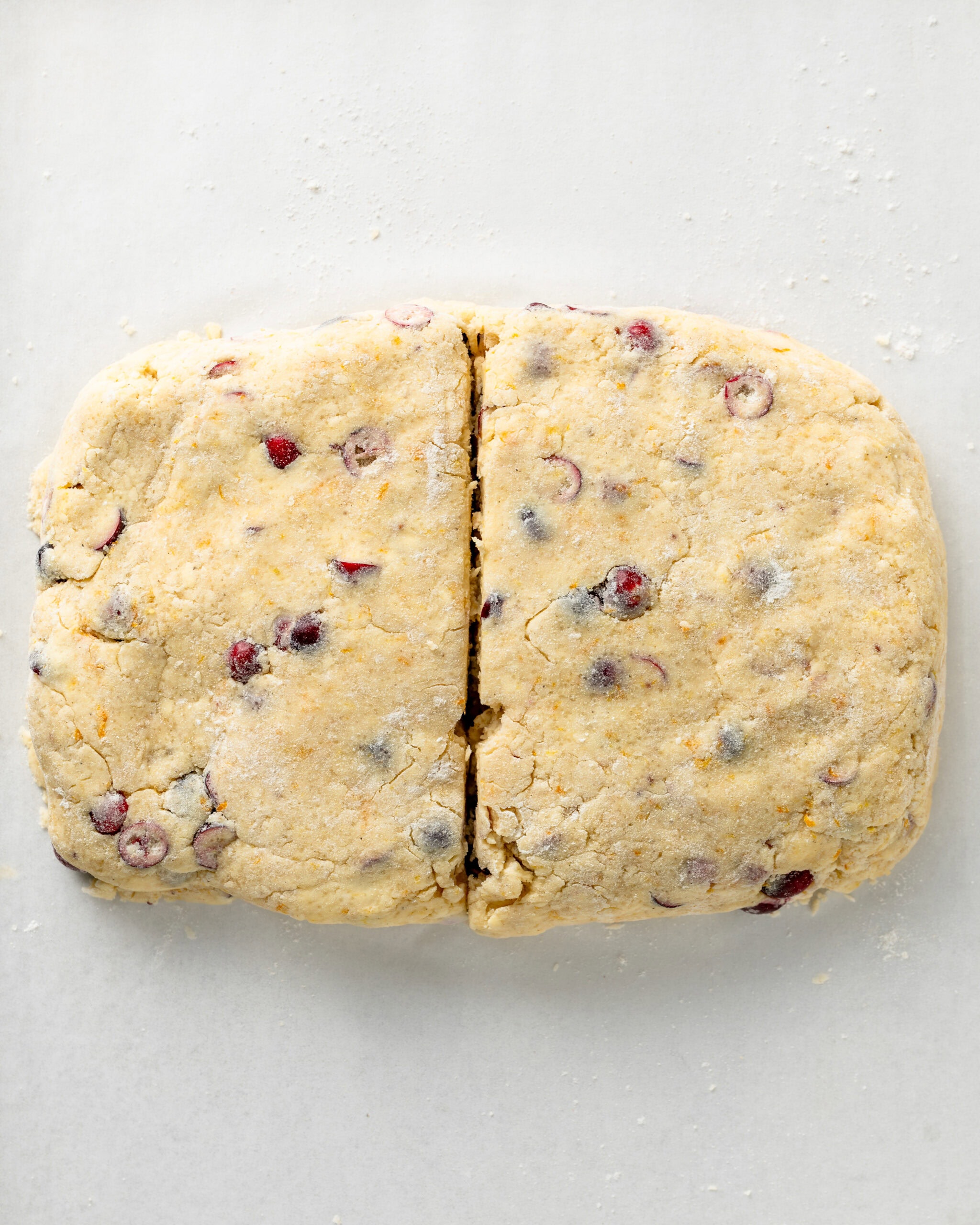 Cut the cranberry orange scone in half.