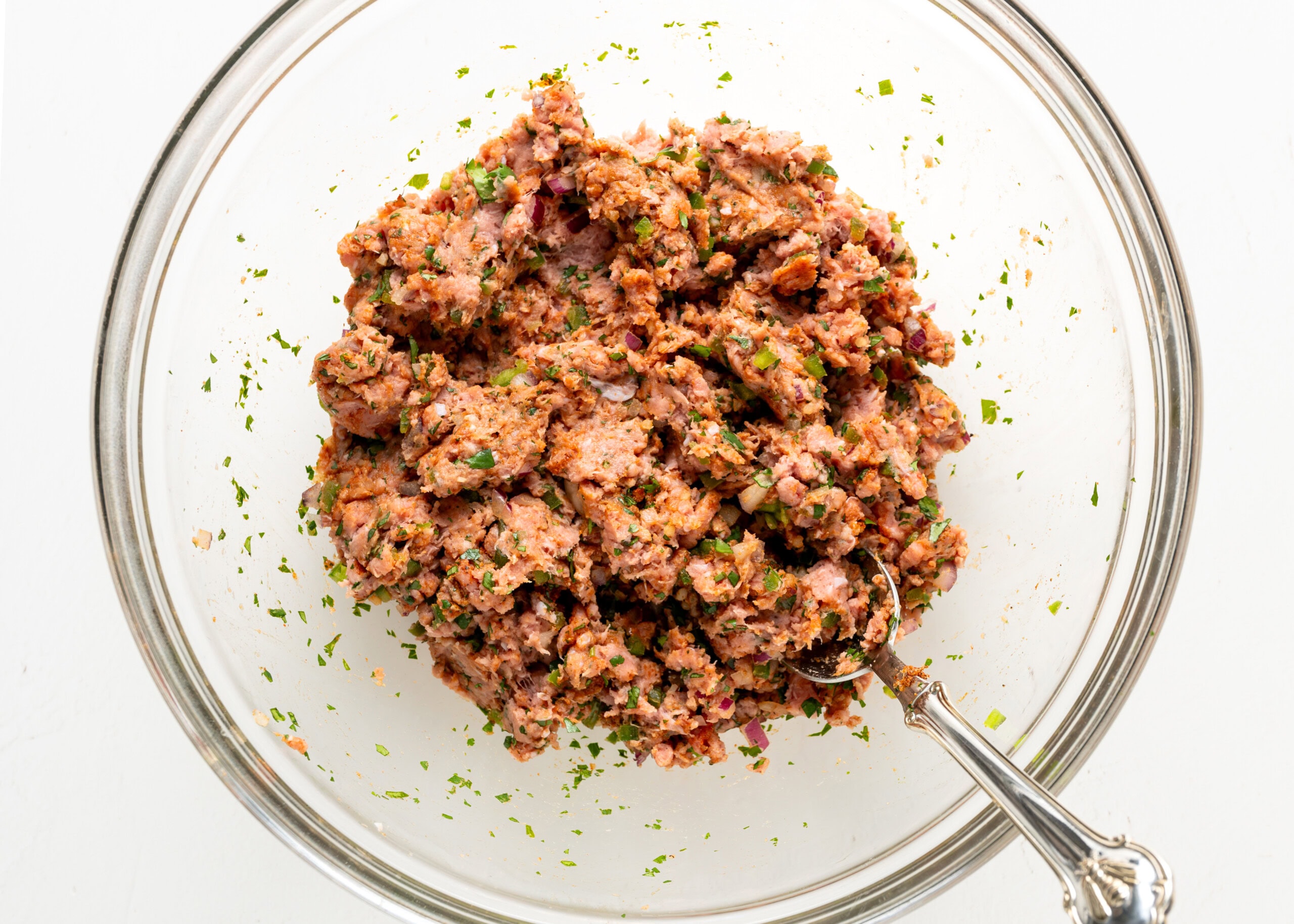 Jalapeno turkey burger mixture in a large glass bowl.