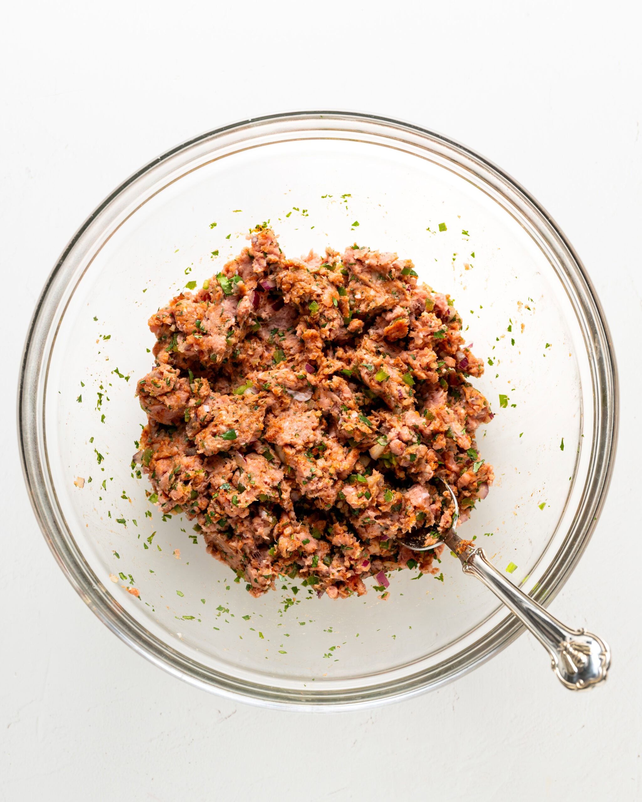 Mixing ingredients together for jalapeno turkey burgers.